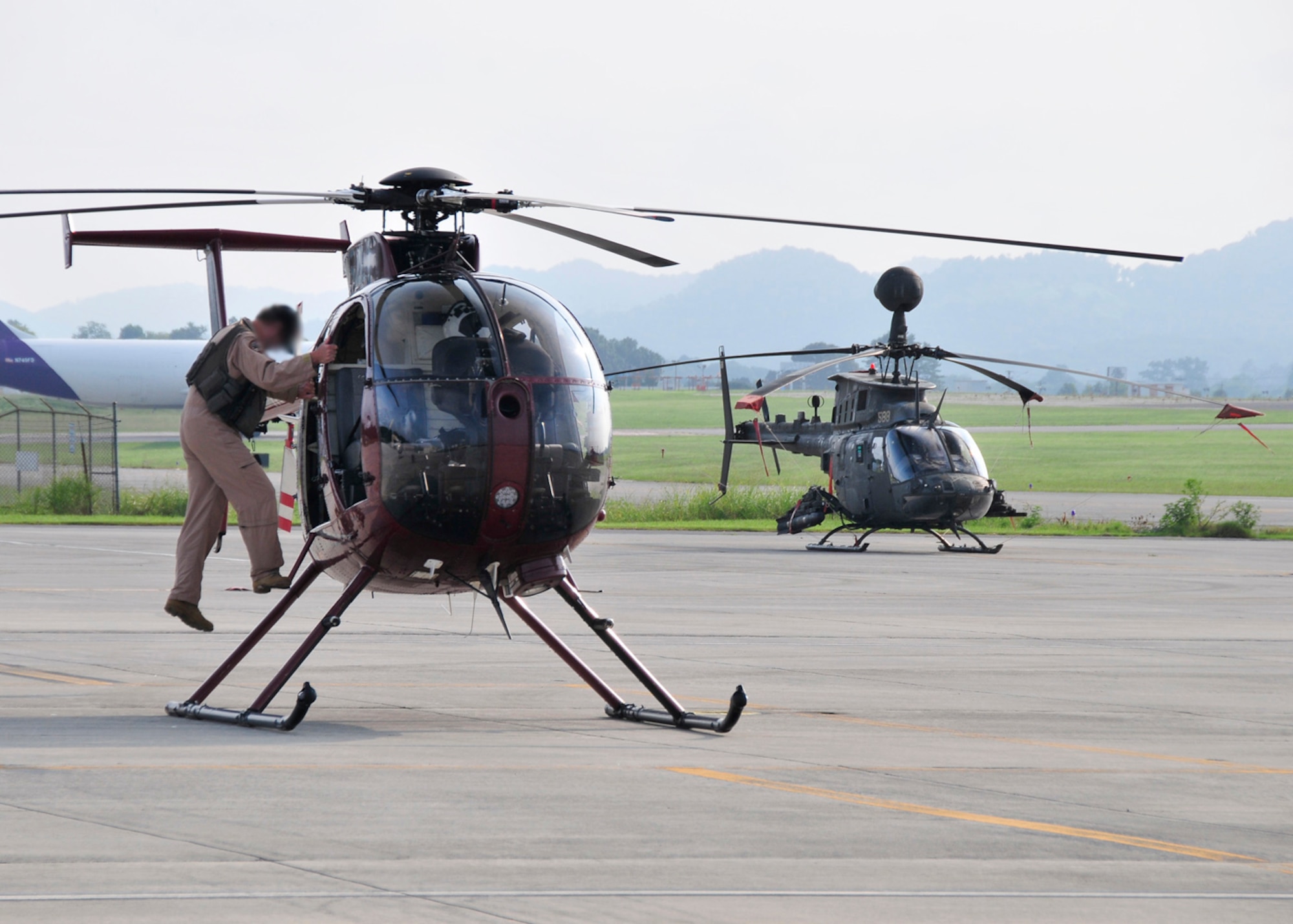 A DEA special agent conducts a pre-flight check prior to take-off at McGhee Tyson Air National Guard Base, TN as part of the aviation division's ERAD program.  (U.S. Air National Guard photo illustration by Master Sgt. Kendra M. Owenby, 134 ARW Public Affairs)