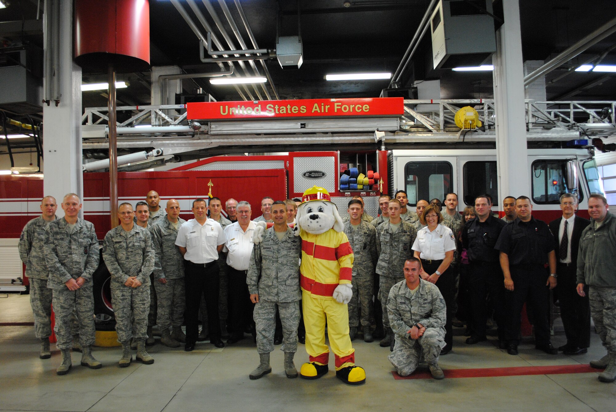 SPANGDAHLEM AIR BASE, Germany – U.S. Air Force Col. David Julazadeh, 52nd Fighter Wing commander, poses with other wing leadership and members of the 52nd Civil Engineer Squadron Fire Department for a photo after the signing of a fire proclamation signifying the beginning of National Fire Prevention Week Sept. 30, 2013. National Fire Prevention Week is America's week long initiative to engage the public and raise awareness of fire safety. (U.S. Air Force courtesy photo/Released) 