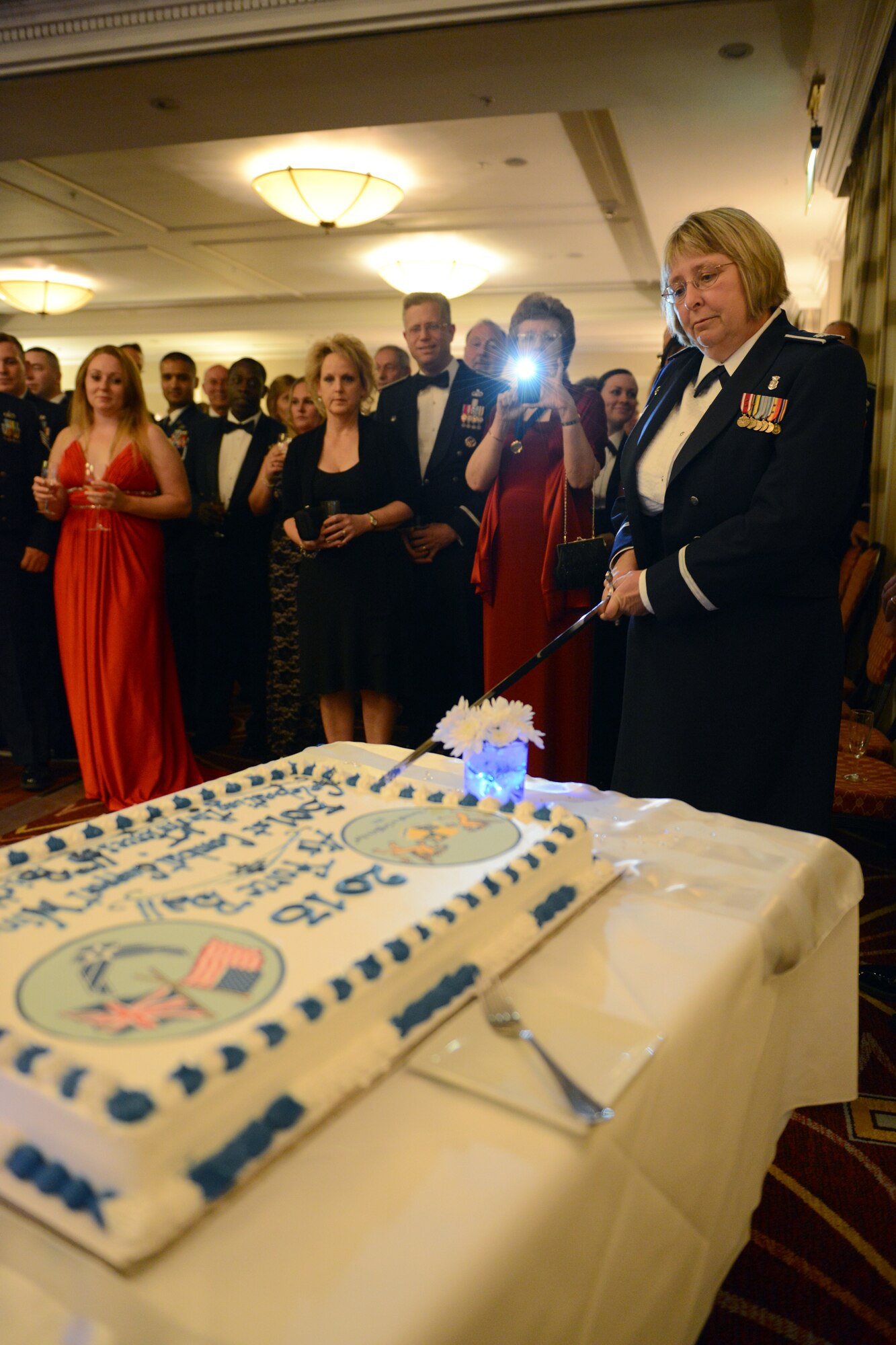 HUNTINGDON, United Kingdom – Lt. Col. Vicki Fair, 423rd Medical Squadron commander, cuts the Air Force’s birthday cake as part of the 501st Combat Support Wing’s 2013 Air Force Ball in Huntingdon, United Kingdom, Sept. 29. Almost 100 members from around the 501st CSW and civic leaders from around England attended the celebration of the 66th anniversary of the start of the U.S. Air Force. (U.S. Air Force photo by Tech. Sgt. Chrissy Best)