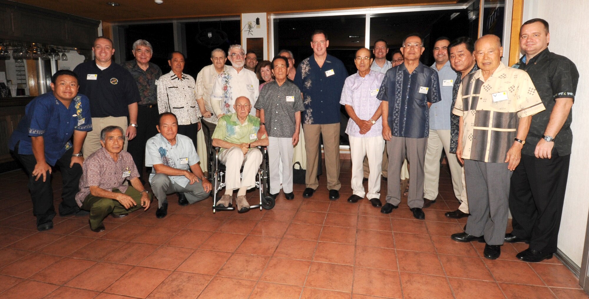 U.S. Air Force Brig. Gen. James Hecker, 18th Wing commander, and Col. Brian McDaniel, 18th Wing vice commander (right), stand with Wing Heritage leaders and American Chamber of Commerce members for a group photo after an Honorary Commanders social event at the Kadena Marina seaside restaurant, Okinawa, Japan, Oct. 1, 2013. The event was held to reinforce ties between the U.S. military and the community, as well as give new commanders the opportunity to meet and greet their honorary commanders. (U.S. Air Force photo by Naoto Anazawa)