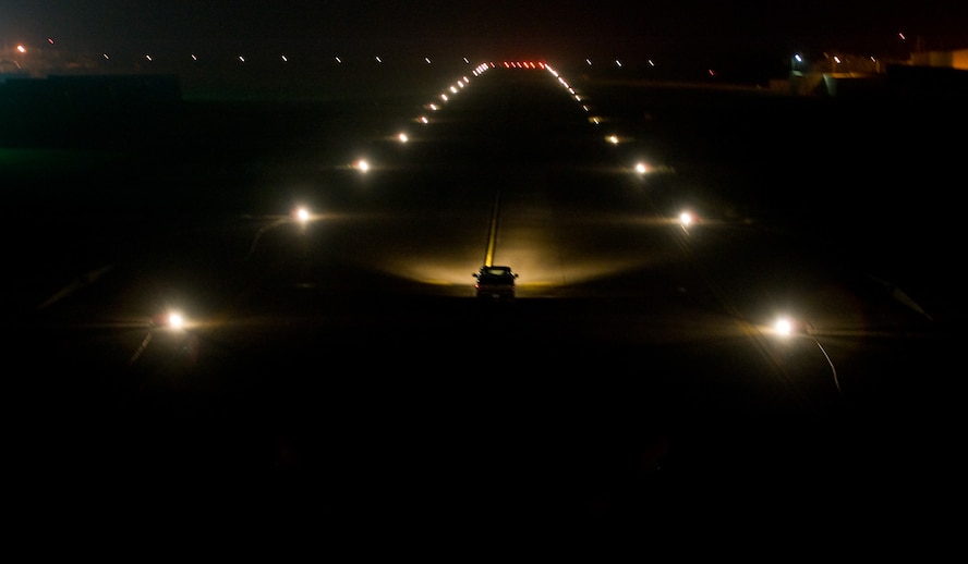 Eighth Civil Engineer Squadron Airmen inspect a runway lighting kit at Kunsan Air Base, Republic of Korea, Sept. 30, 2013. The kit allows Airmen to create an expeditionary runway with proper lighting for both night and daytime operations, even during a power shortage. (U.S. Air Force photo by Senior Airman Armando A. Schwier-Morales/ Released)