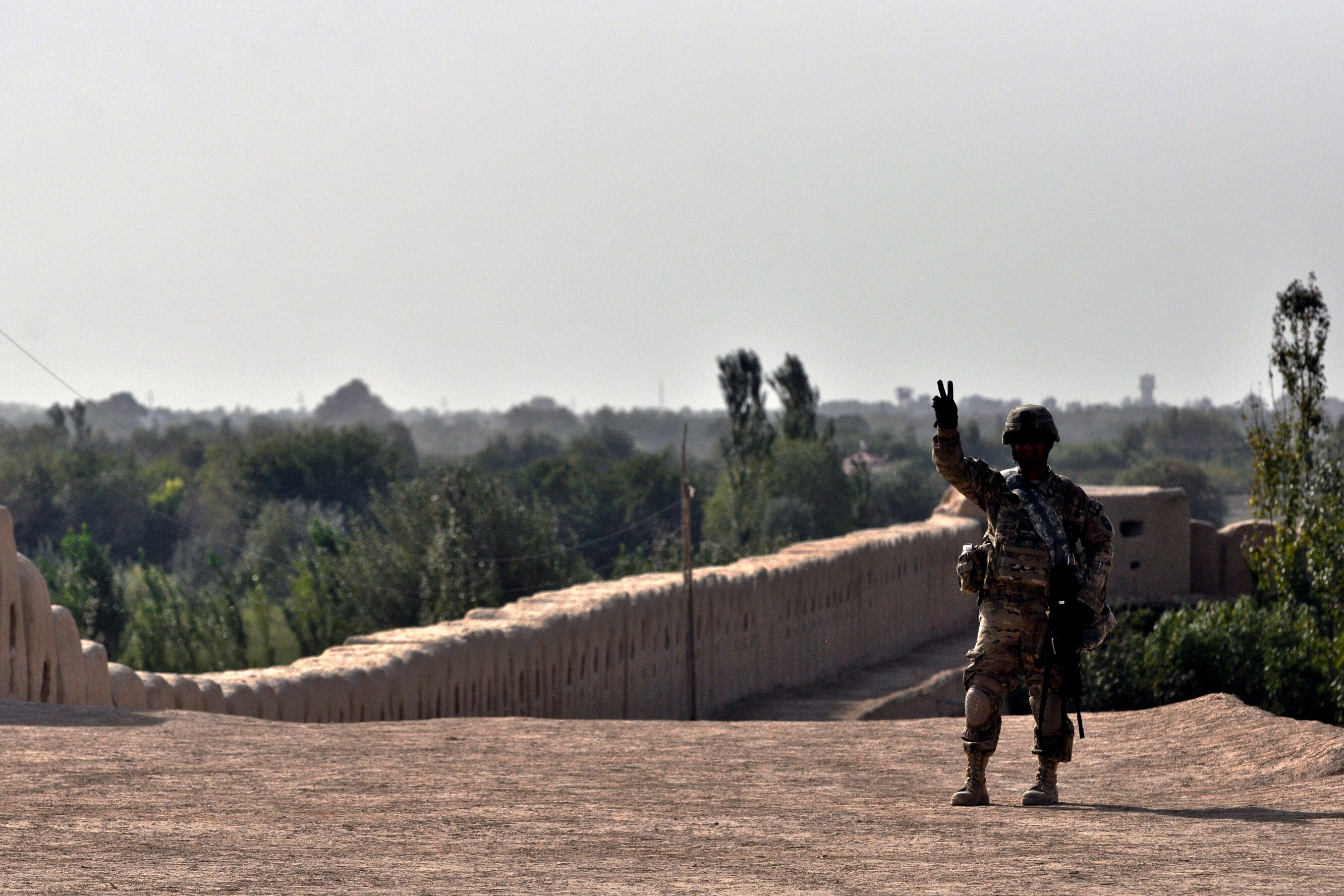Us Army Sgt Damian Raigalipiy Stands Guard Atop A 40 Foot - 