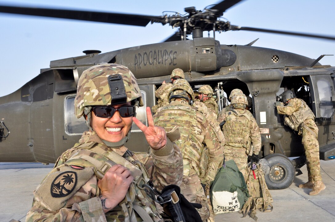 U.S. Army Capt. Kristin Y. Ramos prepares to board a UH-60 Black Hawk with other Guam Guardsmen from Camp Spann in northern Afghanistan en route to Mazar-I-Sharif, Sept. 30, 2013. Ramos commands Company F, 1st Battalion, 294th Infantry Regiment, Guam Army National Guard.