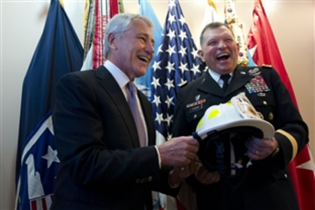 U.S. Defense Secretary Chuck Hagel shares a laugh with U.S. Army Gen. James D. Thurman, then commander of U.S. Forces Korea, before a change-of-command ceremony in Seoul, South Korea, Oct. 2, 2013. Hagel presented Thurman with a firefighter’s helmet with his name on it. During the ceremony, Thurman relinquished command to U.S. Army Gen. Curtis M. Scaparrotti.