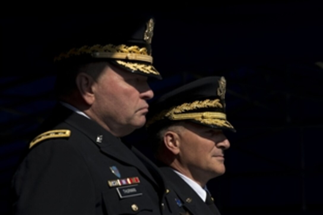 U.S. Army Gen. James D. Thurman, outgoing commanding general of U.S. Forces Korea, stands with U.S. Army Gen. Curtis M. Scaparrotti, the incoming commanding general, at a change-of-command ceremony in Seoul, South Korea, Oct. 2, 2013.