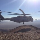 A CH-53E helicopter flies over the desert at Twentynine Palms, Calif., while Marines with Transportation and Support Company, Combat Logistics Battalion 2, 2nd Marine Logistics Group participate in the Integrated Training Exercise from Aug. 20 to Sept. 27, 2013. The Marines of CLB-2 used the exercise to maintain mission readiness. (Courtesy photo)