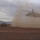 A CH-53E helicopter hovers over the desert of Twentynine Palms, Calif., during a helicopter support team exercise while Marines with Transportation and Support Company, Combat Logistics Battalion 2, 2nd Marine Logistics Group participated in the Integrated Training Exercise Sept. 20, 2013. CLB-2 was at ITX from Aug. 20 to Sept. 27 to maintain skills essential for potential deployments. (Courtesy photo)