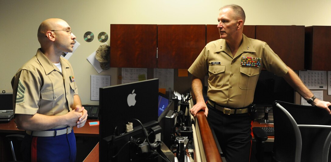 Marine Maj. Gen. Mark A. Brilakis, commanding general, Marine Corps Recruiting Command, meets with Gunnery Sgt. Sam Martinez, communications cheif at 8th Marine Corps District, Naval Air Station Fort Worth Joint Reserve Base, Texas, Oct. 2nd, 2013. Brilakis took command of the Western Recruiting Region on July 12th, 2013. 