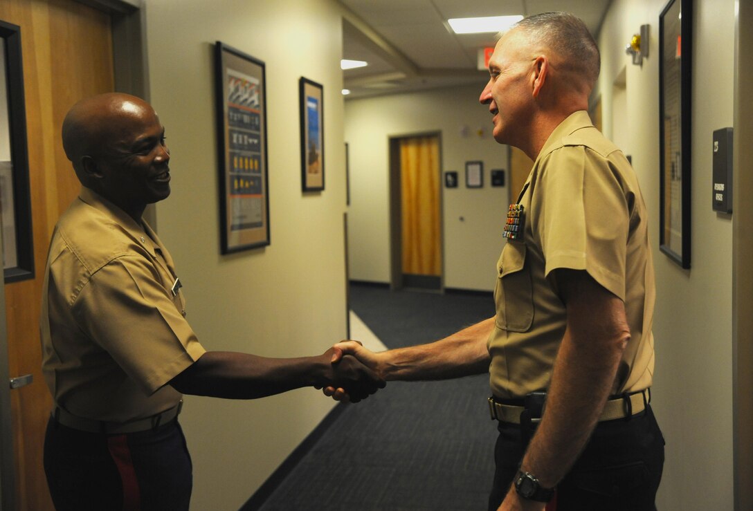 Marine Maj. Gen. Mark A. Brilakis, commanding general, Marine Corps Recruiting Command, meets with Lt. Col. Eric S. Johnson, deputy for recruiting operations at 8th Marine Corps District, Naval Air Station Fort Worth Joint Reserve Base, Texas, Oct. 2nd, 2013. Brilakis took command of the Western Recruiting Region on July 12th, 2013. 