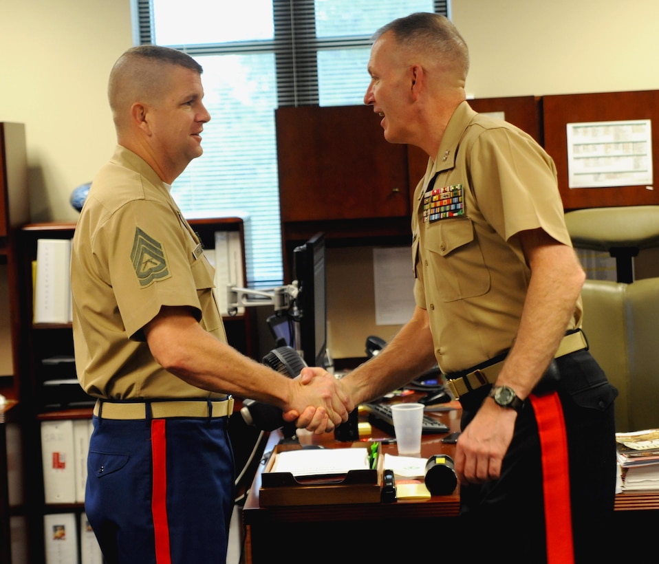 Marine Maj. Gen. Mark A. Brilakis, commanding general, Marine Corps Recruiting Command, meets with GySgt Phillip S. Moore, quality control cheif at 8th Marine Corps District, Naval Air Station Fort Worth Joint Reserve Base, Texas, Oct. 2nd, 2013. Brilakis took command of the Western Recruiting Region on July 12th, 2013. 