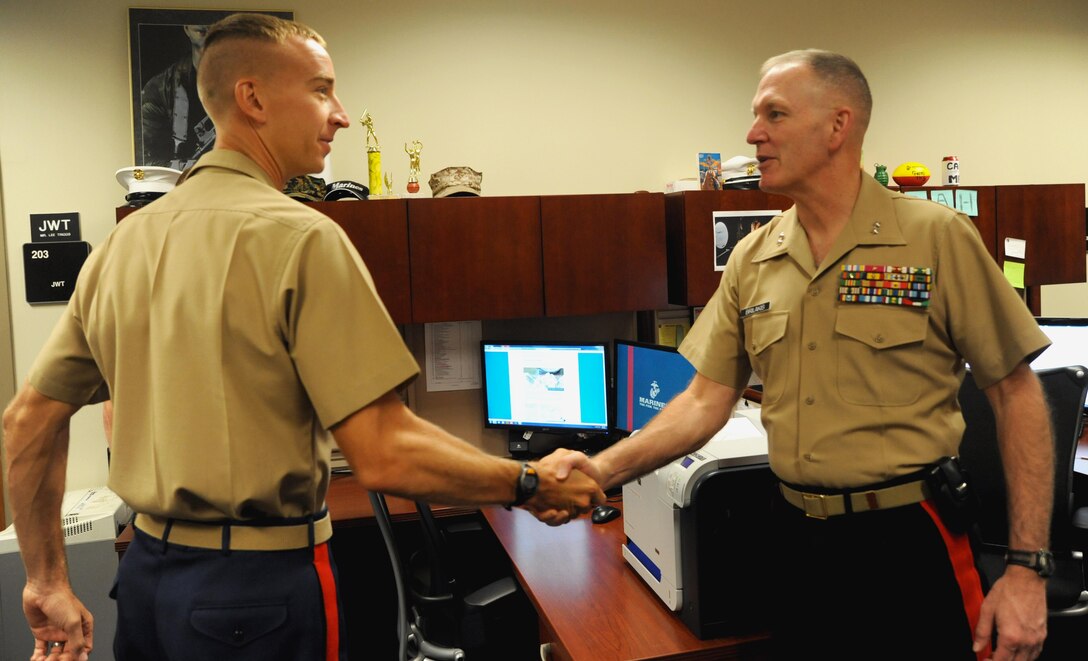 Marine Maj. Gen. Mark A. Brilakis, commanding general, Marine Corps Recruiting Command, meets with Capt. Clinton P. Gebke, public affairs officer at 8th Marine Corps District, Naval Air Station Fort Worth Joint Reserve Base, Texas, Oct. 2nd, 2013. Brilakis took command of the Western Recruiting Region on July 12th, 2013. 