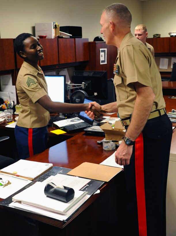 Marine Maj. Gen. Mark A. Brilakis, commanding general, Marine Corps Recruiting Command, meets with Sgt. Teresia W. Kamau, operations clerk at 8th Marine Corps District, Naval Air Station Fort Worth Joint Reserve Base, Texas, Oct. 2nd, 2013. Brilakis took command of the Western Recruiting Region on July 12th, 2013. 