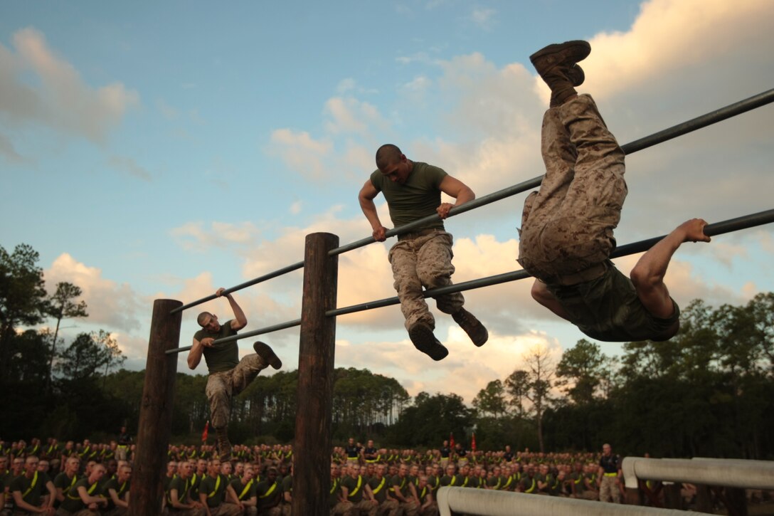 Recruits of Mike Company, 3rd Recruit Training Battalion, race through an obstacle course Sept. 21, 2013, as part of a field meet on Parris Island, S.C. Drill instructors selected a team of recruits from each platoon to compete in various events such as tug of war, a relay race, an obstacle course race and a pushup competition. The meet is designed to motivate the recruits for the upcoming Crucible, the 54-hour culminating event of training.