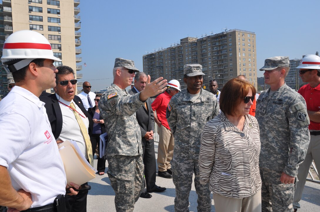 During a visit to New York City Aug. 20-21, 2013, Lt. Gen. Thomas Bostick, U.S. Army Corps of Engineers Commanding General and Chief of Engineers, and Ms. Jo-Ellen Darcy, Assistant Secretary of the Army (Civil Works), receive an update on the Corps' Hurricane Sandy recovery and resiliency operations, including site visits to observe sand placement activities aimed at restoring coastal storm risk reduction projects. (Photo by Hector Mosley)