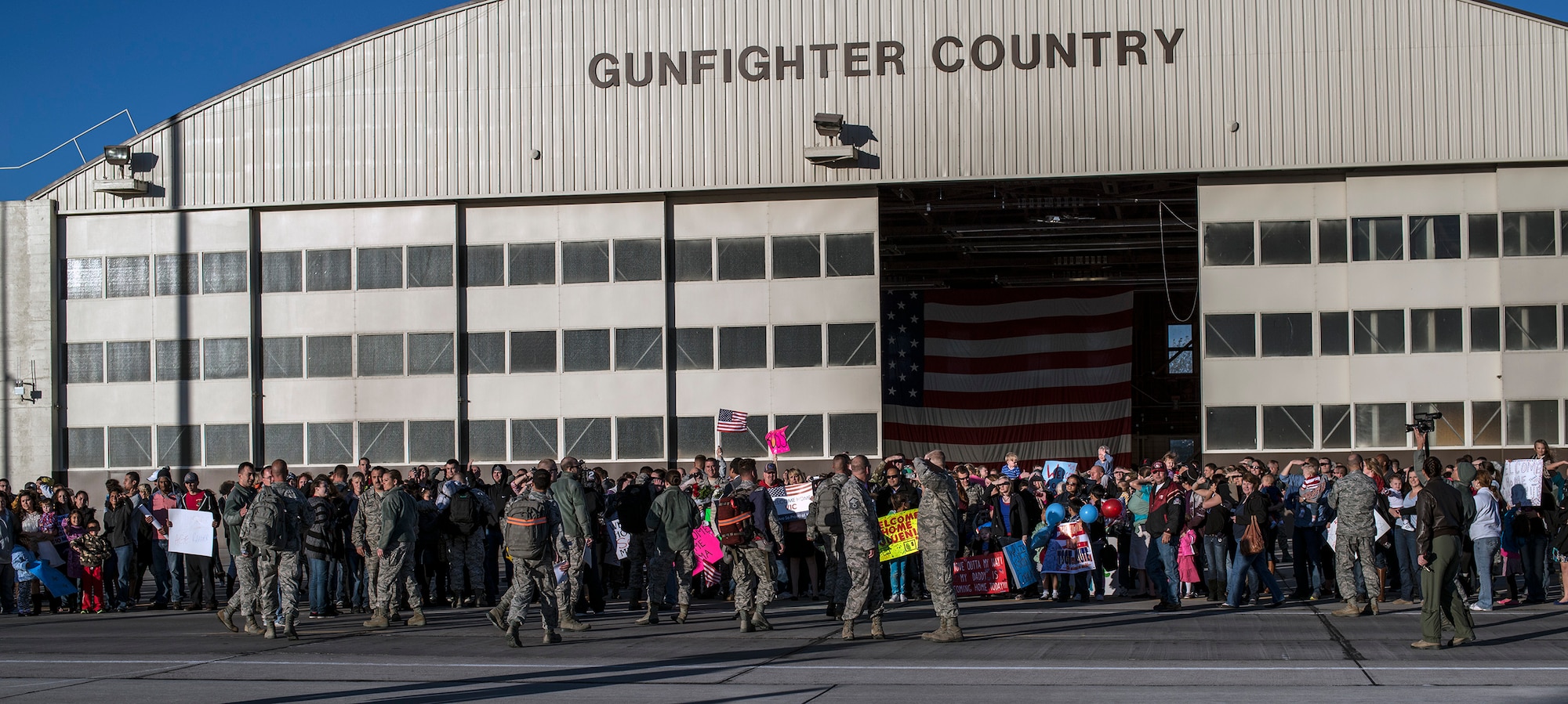 Families, friends and fellow Airmen gather at Mountain Home Air Force Base, Idaho, Oct. 3, 2013. Maintenance professionals from the 366th Maintenance Group and 389th Fighter Squadron, ‘T-Bolts,’ returned from their six-month deployment to Southwest Asia. (U.S. Air Force photo by Master Sgt. Kevin Wallace/RELEASED)
