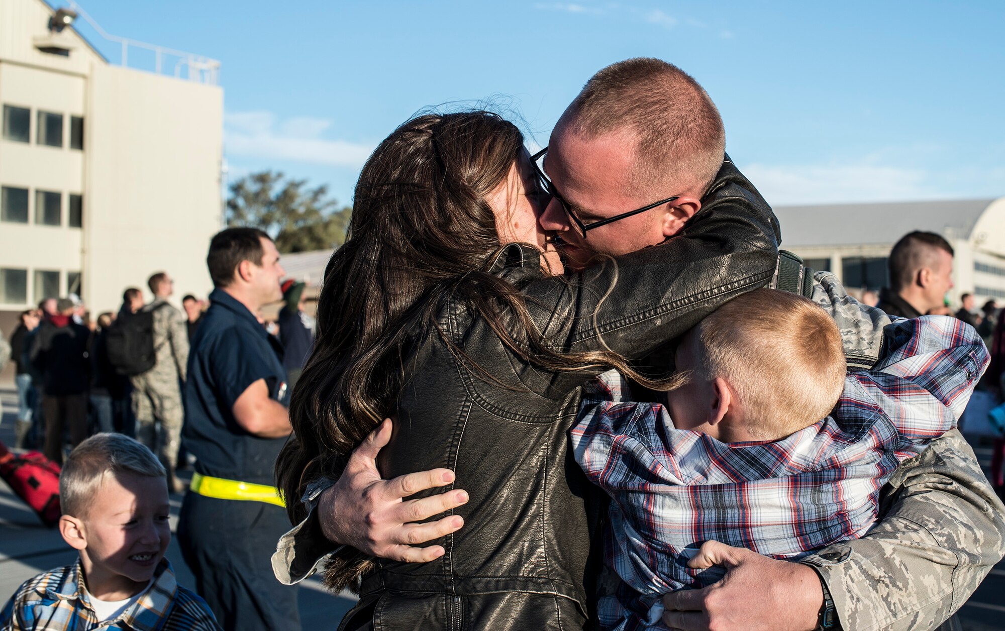 An Air Force family is reunited at Mountain Home Air Force Base, Idaho, Oct. 3, 2013. The sergeant returned from a six-month deployment to Southwest Asia. (U.S. Air Force photo by Master Sgt. Kevin Wallace/RELEASED)