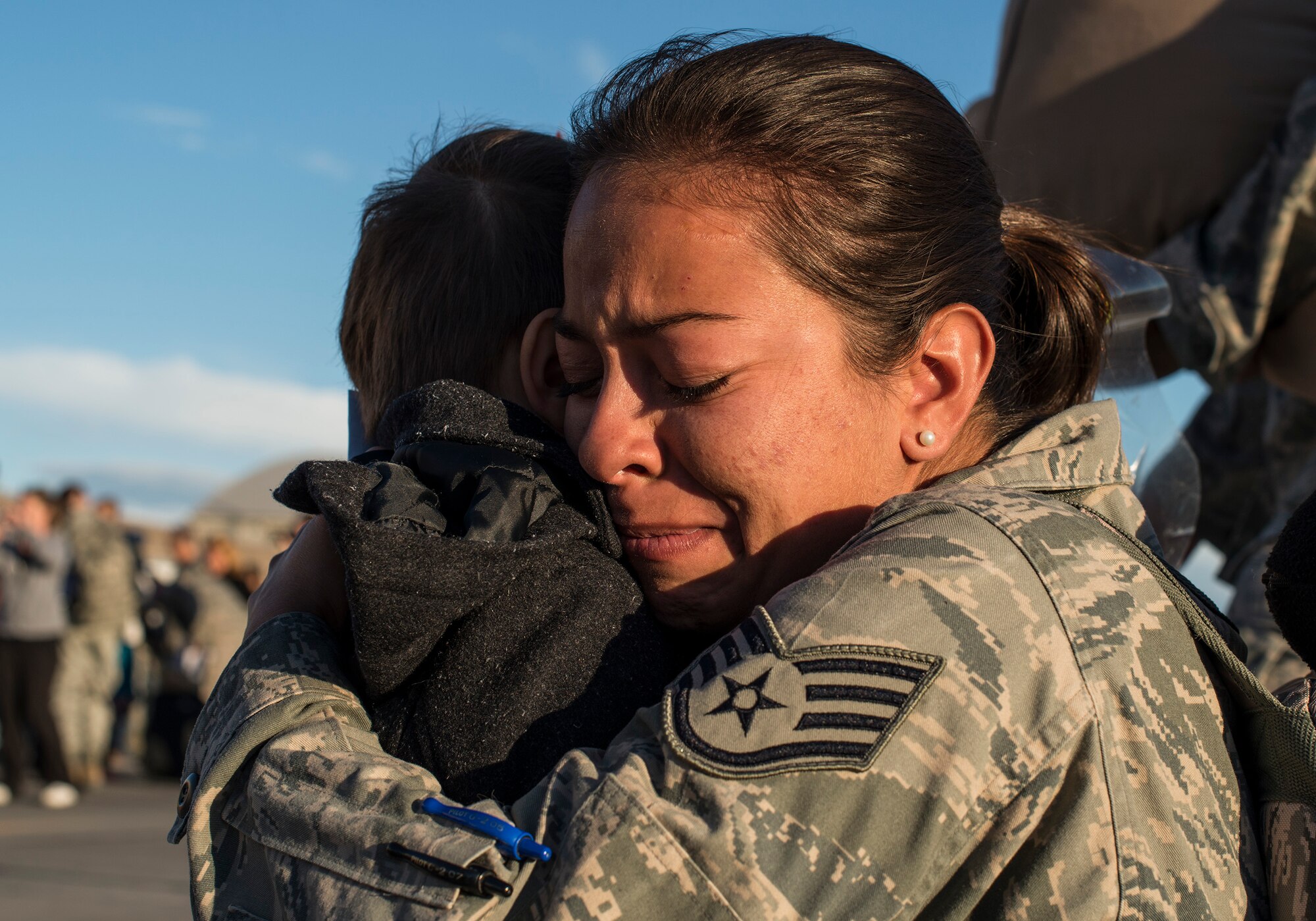 An Air Force staff sergeant hugs her son at the Mountain Home Air Force Base, Idaho, flightline Oct. 3, 2013. The sergeant returned from a six-month deployment to Southwest Asia. (U.S. Air Force photo by Master Sgt. Kevin Wallace/RELEASED)