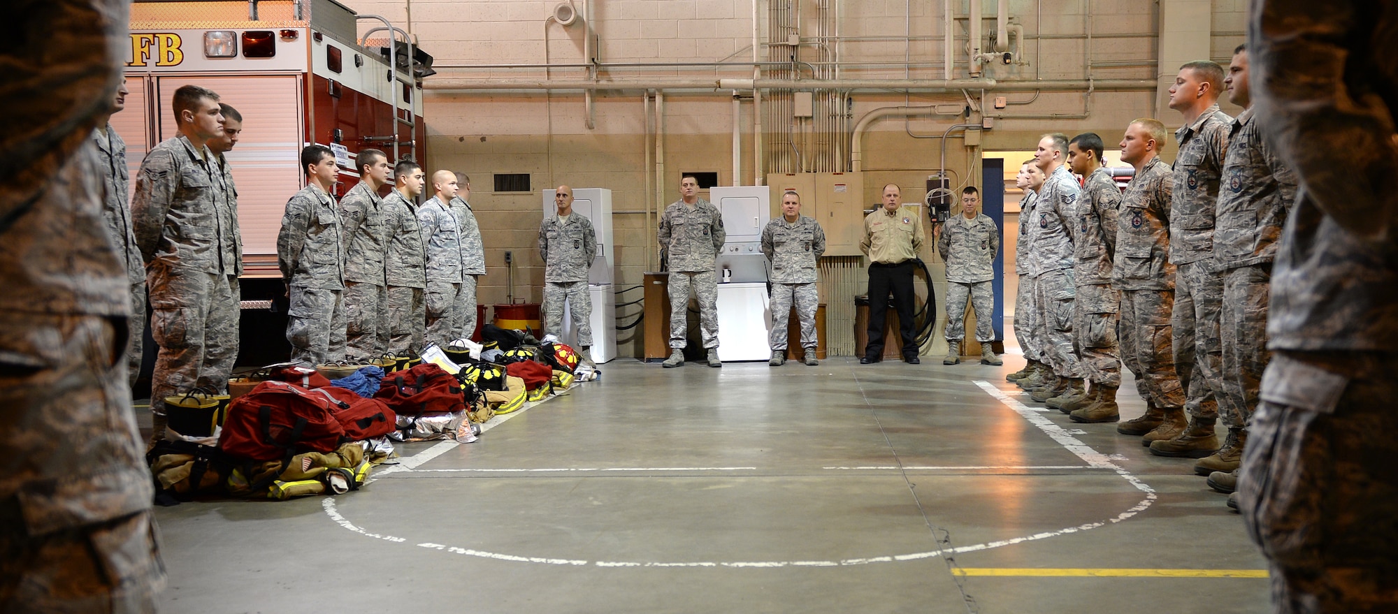 Firefighters from the 354th Civil Engineer Squadron prepare to change watch Sept. 19, 2013, Eielson Air Force Base, Alaska. Fire protection Airmen work 24-hour shifts to maintain base protections nonstop, which is mostly spent training for emergencies. (U.S. Air Force photo by Senior Airman Shawn Nickel/Released) 