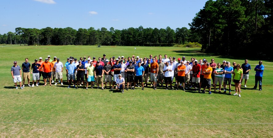 Airmen gather for a group photo before the start of the Free Golf Fun Day at Gator Lakes Golf Course on Hurlburt Field, Fla., Sept. 27, 2013. The Single Airman Program Initiative made it possible for 92 Airmen to golf at no cost. (U.S. Air Force photo/Airman 1st Class Jeff Parkinson)