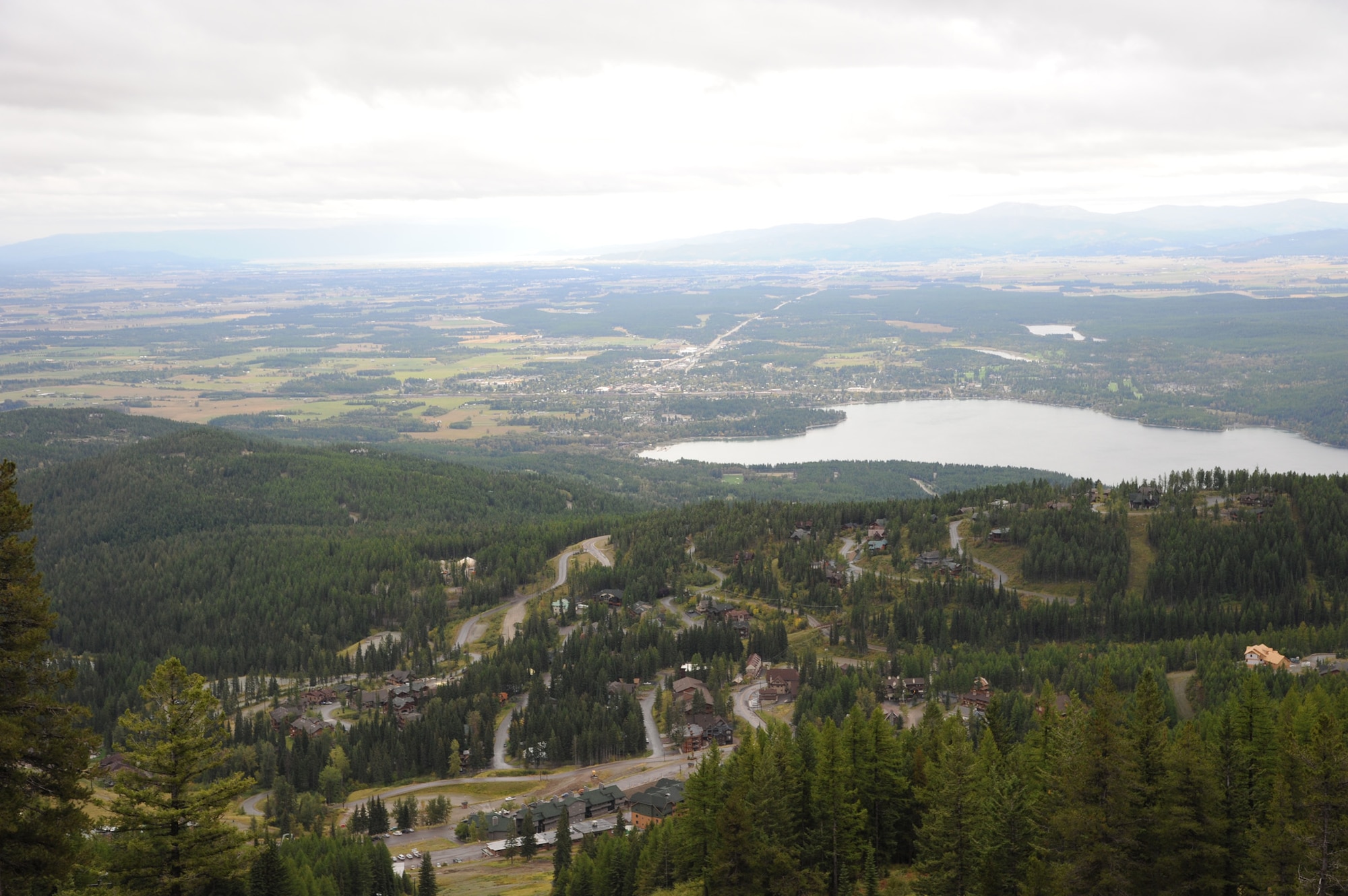 A photograph taken from more than 4,000 feet high on Big Mountain overlooks the town of Whitefish in the valley below. Airmen who attended the retreat were able to zip-line on several different courses and mountain-bike from the top of the mountain, more than 7,000 feet high, to the bottom. (U.S. Air Force Photo/Airman 1st Class Collin Schmidt)   