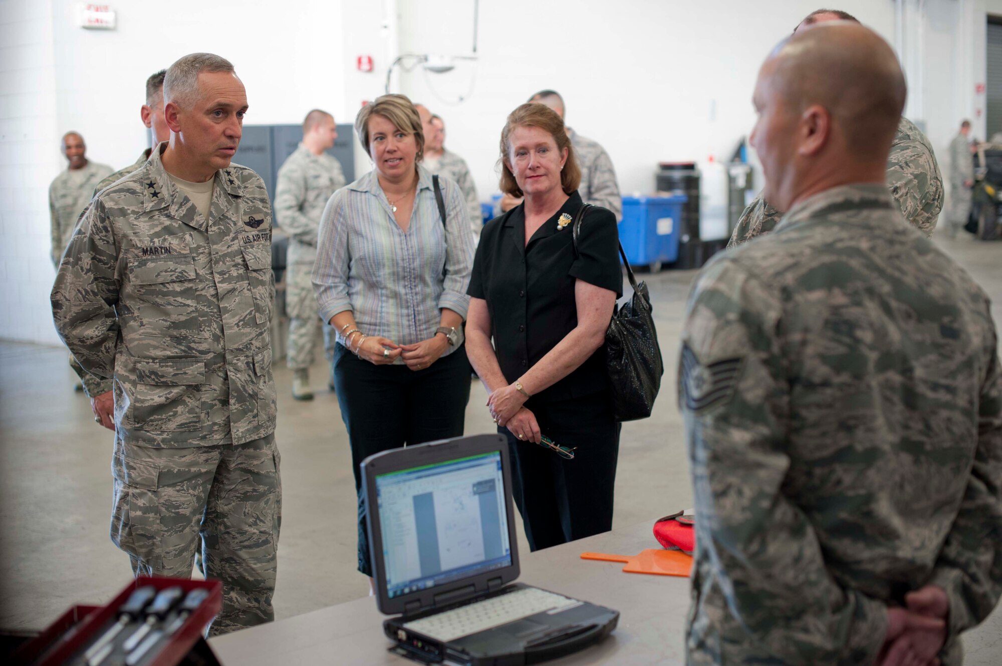 JOINT BASE MCGUIRE-DIX-LAKEHURST, N.J. -- Maj. Gen. Frederick "Rick" Martin, U.S. Air Force Expeditionary Center commander, receives briefing about deployable aircraft maintenance capabilities from Tech. Sgt. Mark Morgan, 819th Global Support Squadron aircraft maintenance craftsman, during a tour of the 621st Contingency Response Wing here, Oct. 2. Martin spent the entire day touring the CRW and hosted a commander's call for all JBMDL-assigned CRW Airmen at its Global Reach Deployment Center. (U.S. Air Force photo by Staff Sgt. Gustavo Gonzalez)