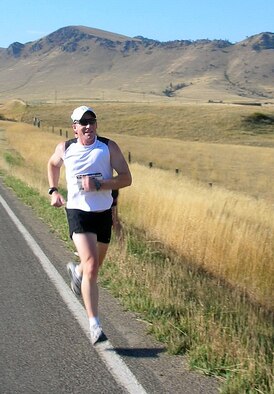 Lt. Col. James Tanner, 341st Medical Operations Squadron chief of physical therapy, participates in a 28-mile relay race during the Wolf Creek Relay near Helena, Mont. Tanner recently earned a perfect score on his physical fitness assessment for the 13th year in a row, despite being diagnosed with liver failure in 2012 and finishing chemotherapy this past June. (Courtesy photo)