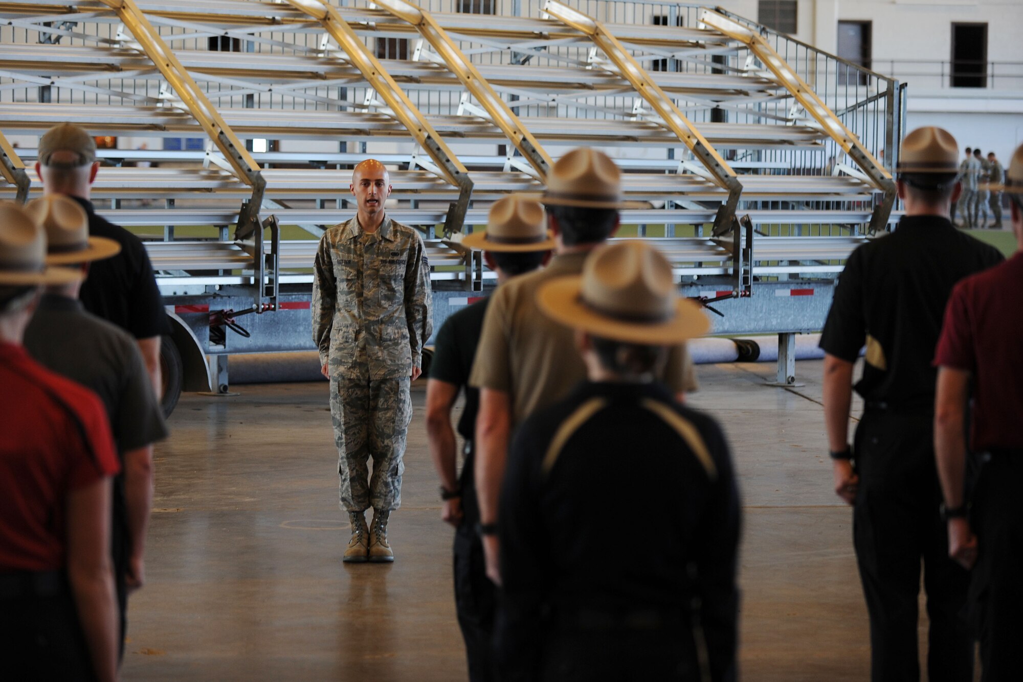 Senior Airman Bradley Sutter, 28th Logistics Readiness Squadron fuels distribution technician, calls movement commands in the Pride Hangar at Ellsworth Air Force Base, S.D. Sept. 30, 2013. Ellsworth Honor Guard provided a two day training course to help form the Pennington County Sheriff’s Department Honor Guard program. (U.S. Air Force photo by Airman 1st Class Rebecca Imwalle/Released)