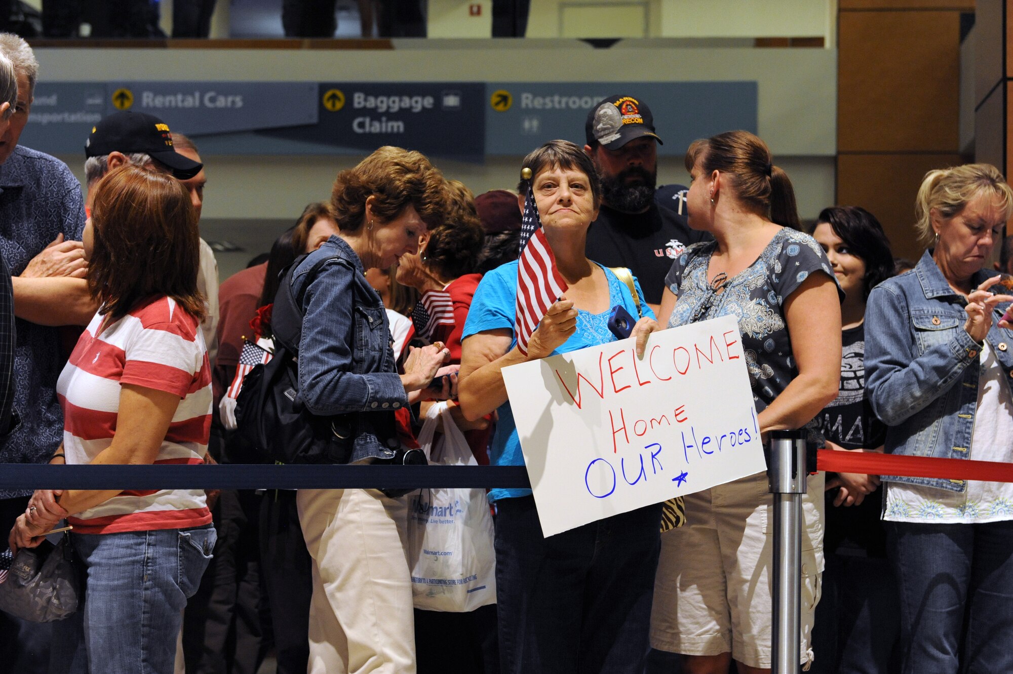Family and friends wait for World War II veterans with the Mississippi Gulf Coast Honor Flight to return from Washington, D.C., Oct 1, 2013, at the Gulfport/Biloxi International Airport. The Honor Flight is a nonprofit program that sends veterans to Washington, D.C., to see national monuments. (U.S. Air Force photos by Airman 1st Class Stephan Coleman)