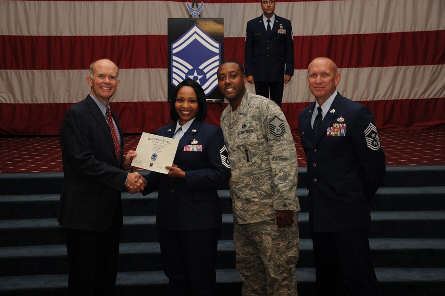 Senior Master Sgt. Latoya Morgan, Air Force Global Strike Command, receives a certificate of promotion from Jeffrey Beene, AFGSC director of staff, and Chief Master Sgt. Brian Hornback, AFGSC command chief, during the September Wing Promotion Ceremony on Barksdale Air Force Base, La., Sept. 30, 2013. (U.S. Air Force photo/Senior Airman Sean Martin)