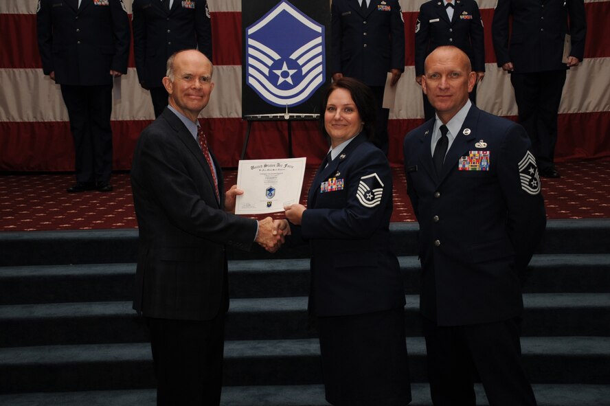 Master Sgt. Joelle Silny, Air Force Global Strike Command, receives a certificate of promotion from Jeffrey Beene, AFGSC director of staff, and Chief Master Sgt. Brian Hornback, AFGSC command chief, during the September Wing Promotion Ceremony on Barksdale Air Force Base, La., Sept. 30, 2013. (U.S. Air Force photo/Senior Airman Sean Martin)