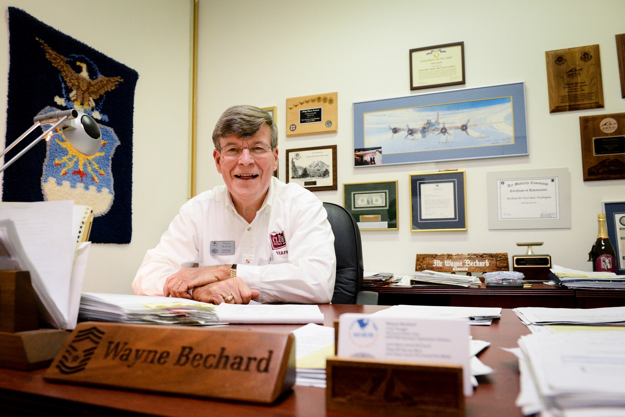 Wayne Bechard, McChord Club manager, sits in his office, Sept. 27, 2013, just a few days prior to his retirement at Joint Base Lewis-McChord, Wash. The memorabilia on his office walls reflect the 43 years he served in the Department of Defense. (U.S. Air Force photo/Tech. Sgt. Sean Tobin)