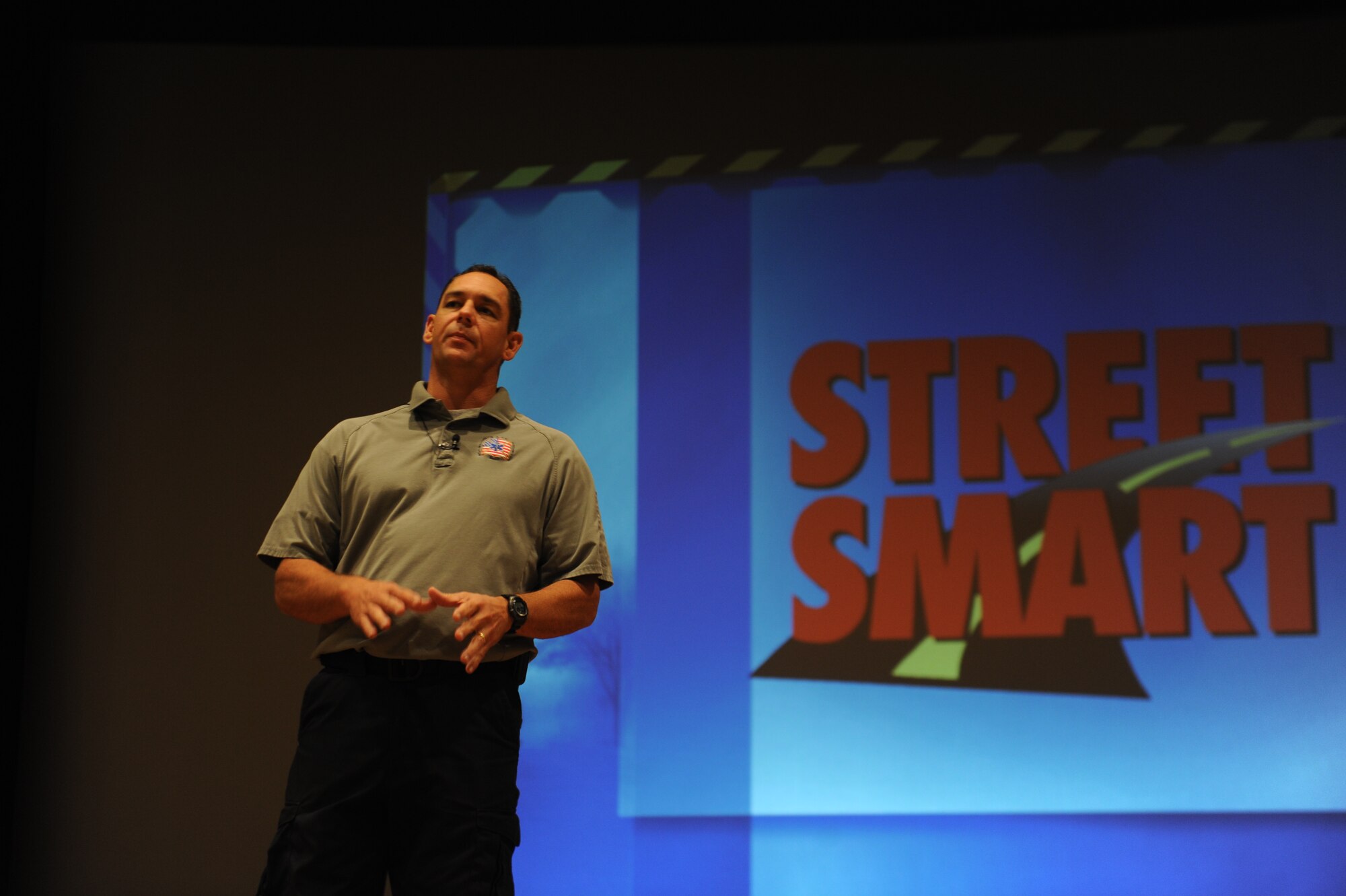 Scott Neusch, a firefighter and paramedic from Orlando, Fla., speaks during a briefing Sept. 18, 2013, at the base theater on Dyess Air Force Base, Texas. Neusch is a representative from a program called Stay Alive from Education, better known as S.A.F.E. The program informs people of the importance of not drinking and driving, always wearing a seatbelt and not driving under the influence.(U.S. Air Force photo by Airman 1st Class Alexander Guerrero/Released)