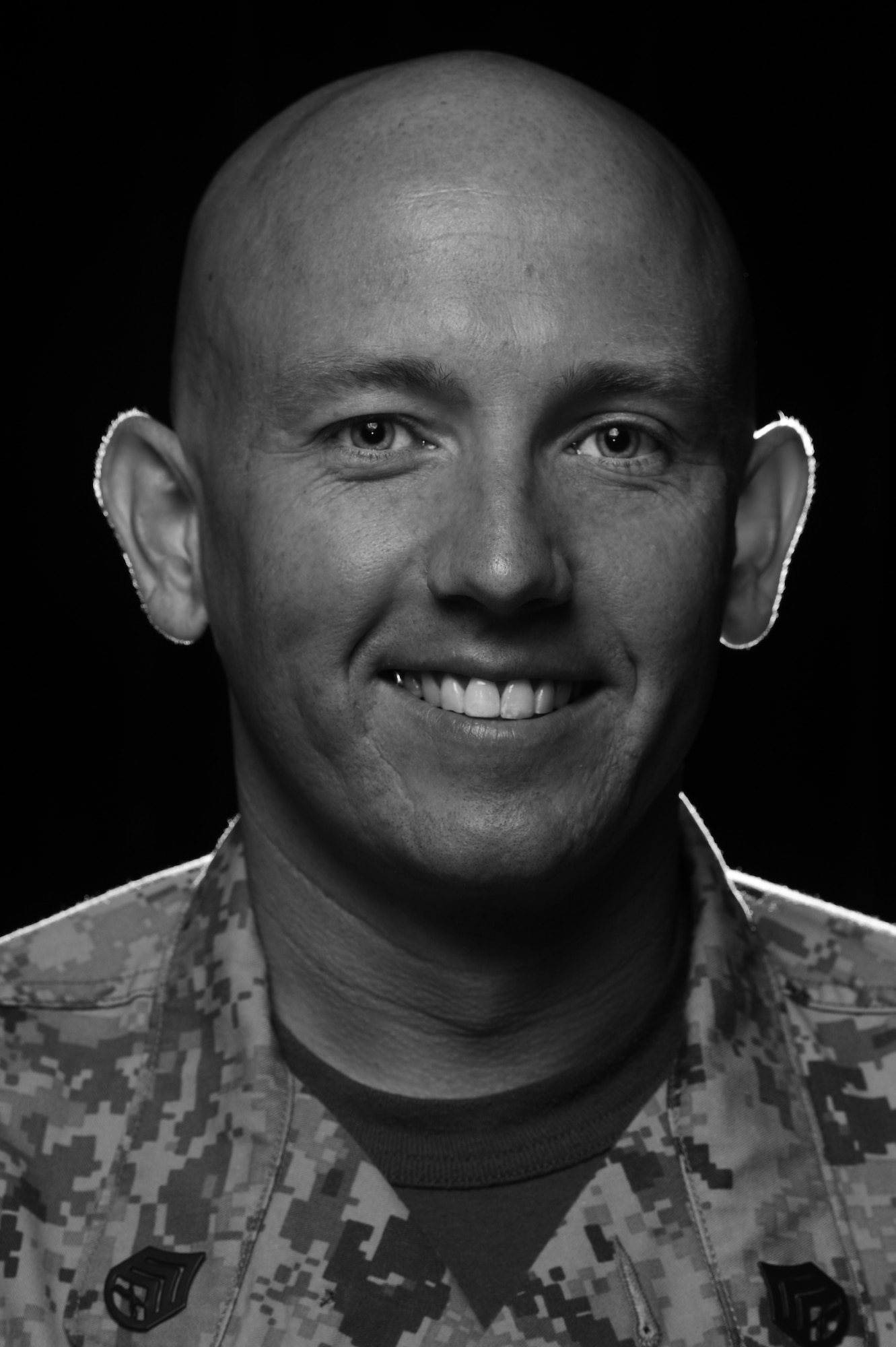 Marine Corps Staff Sgt. Christopher Lambert, Marine Corps Detachment instructor, attributes his upbringing in rural Appalachia to the work ethic that he has found mirrored in military life and volunteerism, which in turn has lead to more than 1,200 personal hours of volunteer service and an outstanding military volunteer medal for his three years at Keesler. (U.S. Air Force photo by Staff Sgt. Greg C. Biondo)