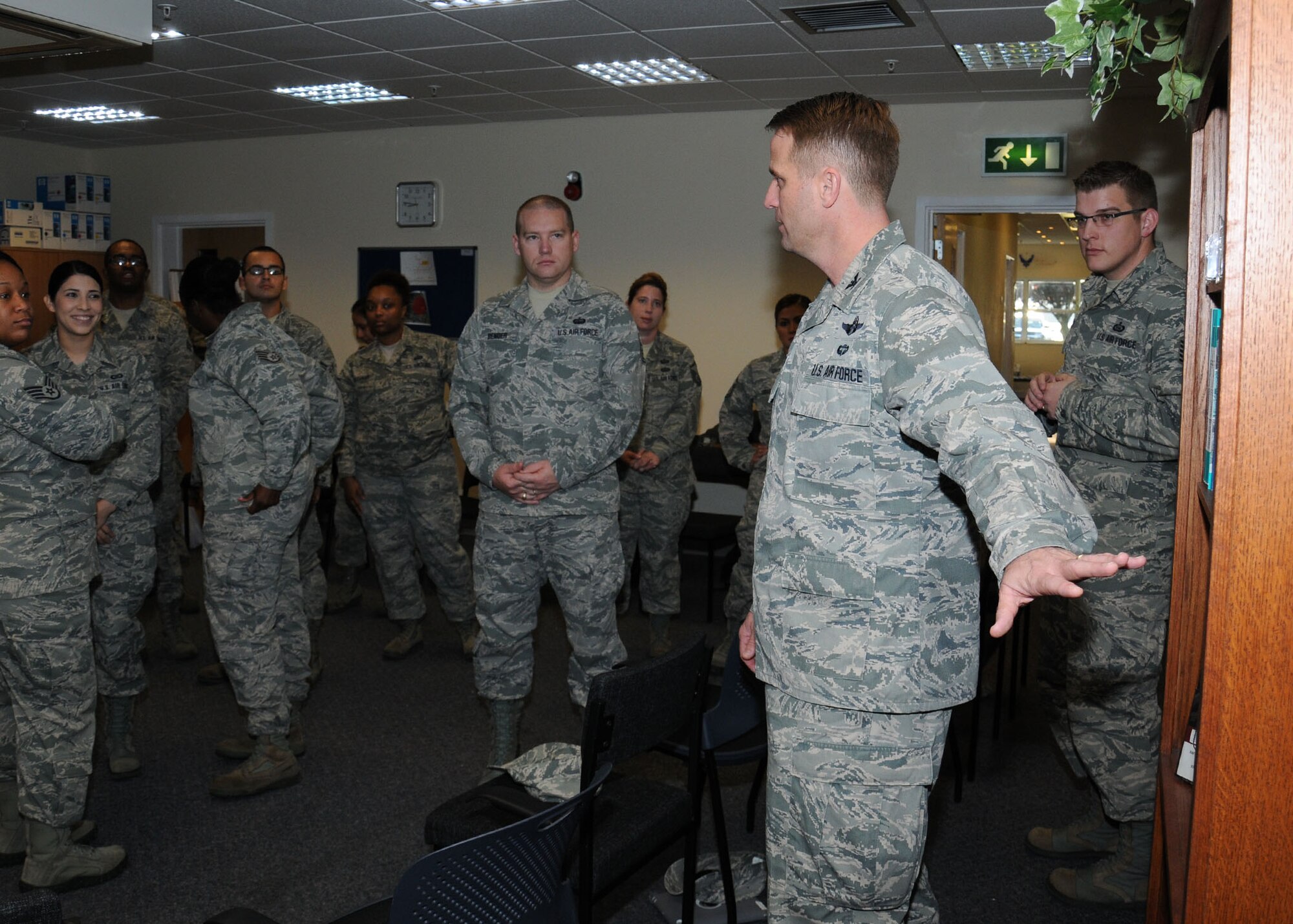 U.S. Air Force Col. David Cox, 100th Air Refueling Wing vice commander, shows the new living room in the Sexual Assault Prevention and Response office to Team Mildenhall victim advocates Oct. 3, 2013, on RAF Mildenhall, England. Prior to viewing the new living room, the group discussed many topics including their main goals of prevention, getting the word out with repeat messages and how to keep the training fresh.  (U.S. Air Force photo by Gina Randall/Released)