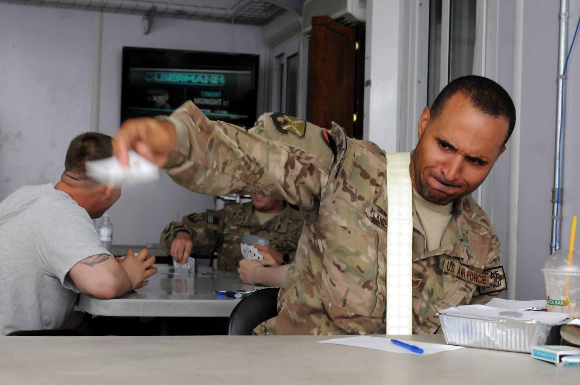 Staff Sgt. Bryant Lanier, 451st Air Expeditionary Wing throws down a card at the Camp Bradley Smith Morale Room Sept. 25, 2013. Spades is just one of many events hosted by the 451st Expeditionary Force Support Flight. The various 451st EFSF morale events ceased operations Oct. 1, 2013 as part of retrograde efforts at Kandahar Airfield. The 451st EFSF is also turning over the lodging operation to the U.S. Army, with a full transfer completed by the end of October. During the last six months, more than 4,800 people have participated in 151 different morale events, and the non-appropriated fund resale shop in the Lodging Office has sold more than $84,000 of inventory, using the proceeds to fund prizes, barbecues and other events for the 451st Air Expeditionary Wing. (U.S. Air Force photo story/ Senior Airman Jack Sanders)