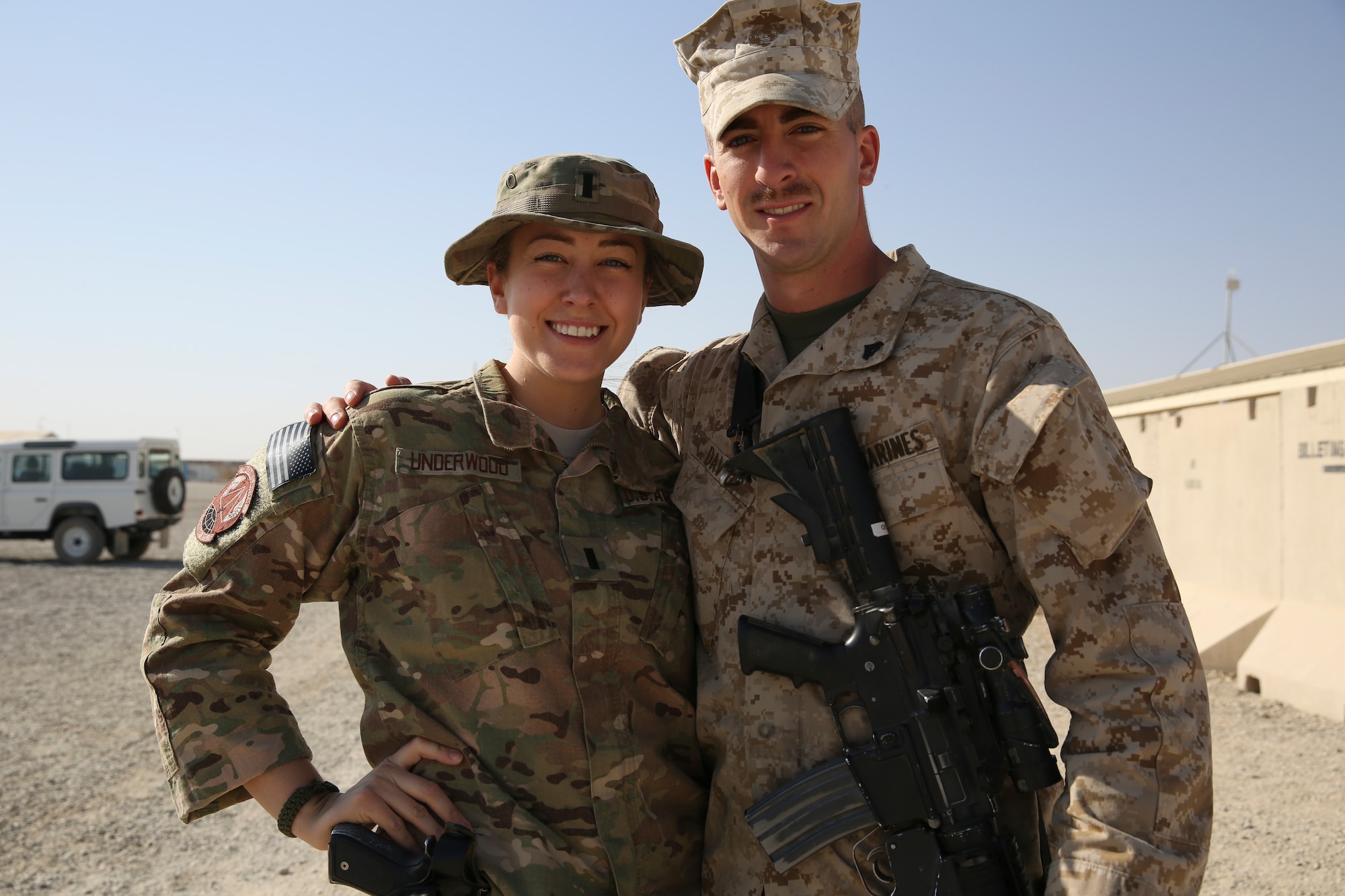 Air Force 1st Lt. Jamie spends time with her younger brother Marine Cpl. Tyler David during a one-day visit to Camp Leatherneck Sept. 24. Jamie has been deployed to Afghanistan since April and David just arrived this month. The reunion is the first time the siblings have seen each other in over six months. Jamie is an intelligence officer with 495th Expeditionary Intelligence Squadron. David is an assistant patrol leader with India Company, 3rd Battalion, 7th Marine Regiment. (Official United States Marine Corps photo by Cpl. Corey Dabney.)