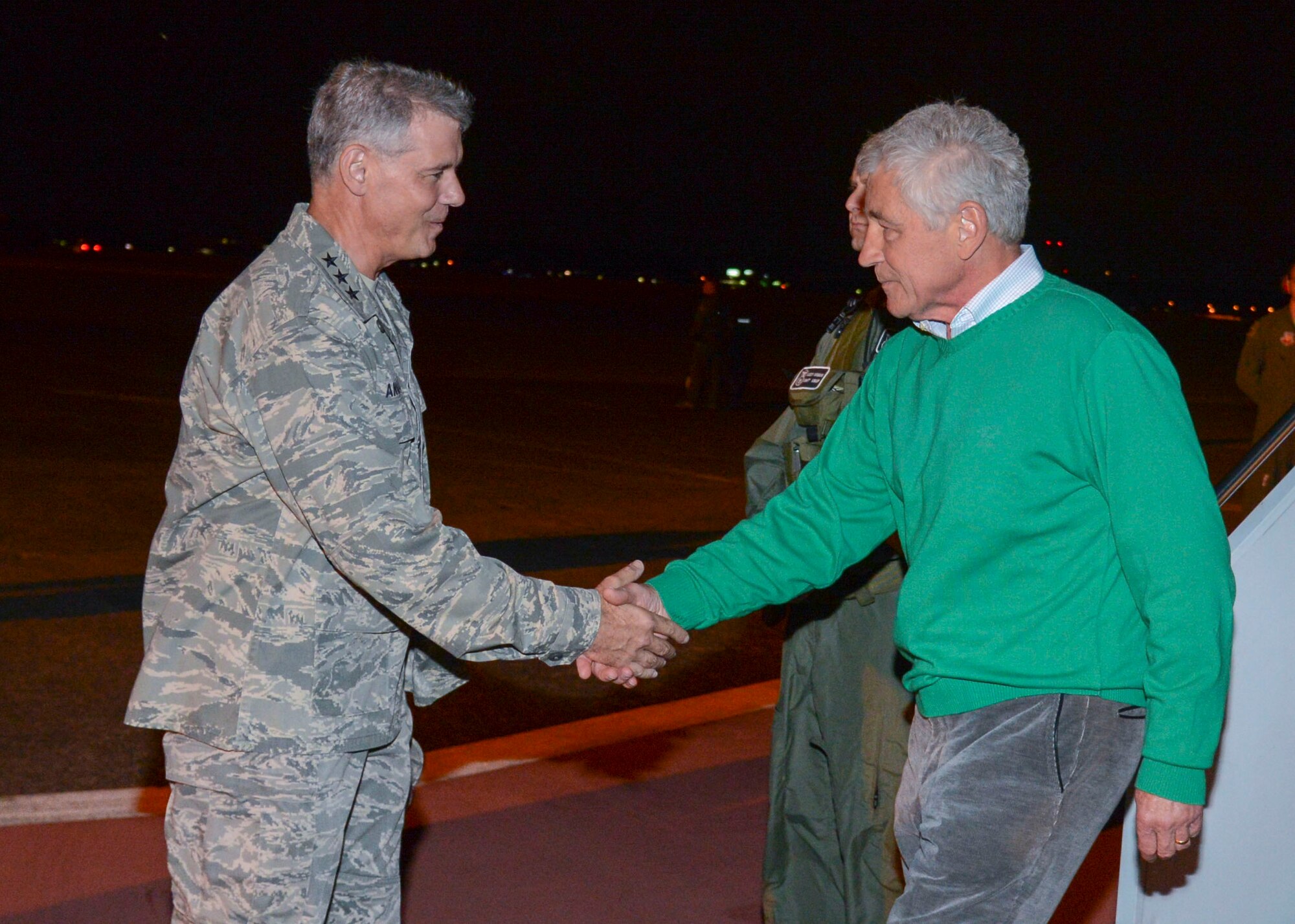 U.S. Air Force Lt. Gen. Sam Angelella, U.S. Forces, Japan and 5th Air Forces commander, greets U.S. Secretary of Defense Chuck Hagel as he arrives at Yokota Air Base, Japan, Oct. 2, 2013. Secretary Hagel and Secretary of State John Kerry are slated to conduct U.S.-Japan Ministerial meetings with Japanese officials this week. (U.S. Air Force photo by Airman 1st Class Soo Kim/Released)