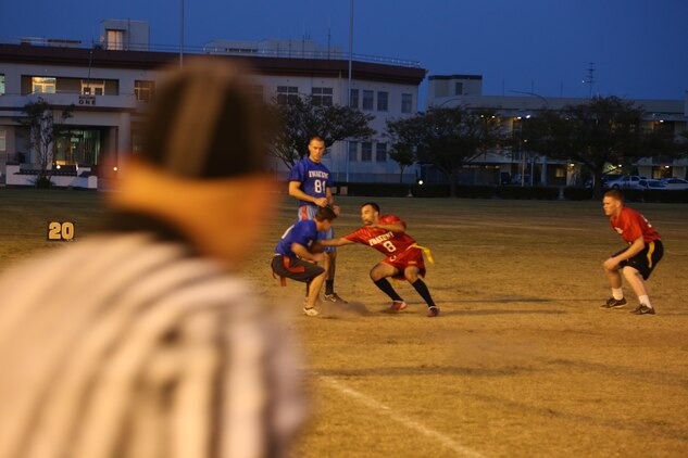 Hector Mecias, Deizlz defensive back (Red) reaches for the flag of a Dental player during an intramural flag football game Oct. 3, 2013. The Deizlz won with a score of 21-15.  