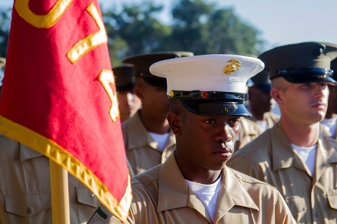 Pfc. Elvis Liburd, honor graduate for platoon 3074, stands at parade rest before graduation aboard Parris Island, S.C., Oct. 4, 2013. Liburd, a native of Tampa, Fla., and recruited by Staff Sgt. Paul Gomez, recruiter from Recruiting Substation Temple Terrace Recruiting Station Orlando, will be able to enjoy some much deserved leave with his family as he prepares for Marine Combat Training in Camp Geiger, N.C. (U.S. Marine Corps photo by Lance Cpl. John-Paul Imbody)