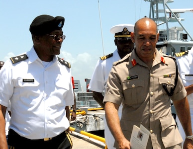 Army Maj. Gen. Errol R. Schwartz, commanding general of the District of Columbia National Guard, tours Jamaica Defence Force facilities with Jamaican Maj. Gen. Antony B. Anderson, commander of the Jamaica Defence Force, June 27, 2012. Schwartz's visit was in honor of the Jamaica Defence Force's first Military Tattoo in almost 30 years. Jamaica is partnered with the District of Columbia National Guard through the National Guard Bureau's State Partnership Program.