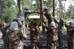 Women from the Colorado Air National Guard and Jordanian Armed Forces participate in the V Walk at the High Ropes course at the U.S. Air Force Academy in Colorado Springs, Colo., June 5, 2012. Colorado and Jordan started women’s leadership events back in 2009 and have executed eight of these types of events since. The National Guard Bureau’s State Partnership Program links U.S. states with foreign nations to promote and enhance bilateral relations; supporting homeland defense and international relations by nurturing dependable, collaborative partners for coalition operations in an era of persistent conflict. Colorado and Jordan’s partnership was the first, and is the only, state partnership with a Middle Eastern nation and has endured for eight years. (Official Air National Guard photo by Maj. Nicole David) (Released)