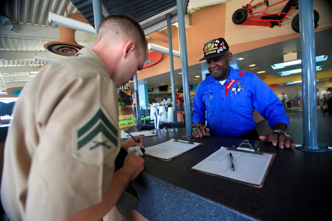 Retired Gunnery Sgt. Chuck Carter, former boxing champion, coach and greeter at 22 Area chow hall in Camp Pendleton, Calif., Oct. 4. Carter greets Marines, accompanied by his signature cadences playing loudly on a stereo at his side.