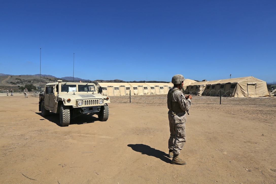 Marines with Combat Logistics Regiment 17, 1st Marine Logistics Group, conduct perimeter checks during a 1st MLG combat operations center exercise aboard Camp Pendleton, Calif., Sept. 25, 2013. The exercise was conducted to practice command and control at the group level. CLR-17 coordinated with other units within 1st MLG such as CLR-1, CLR-15, Combat Logistics Battalion 15 and 7th Engineer Support Battalion. 
