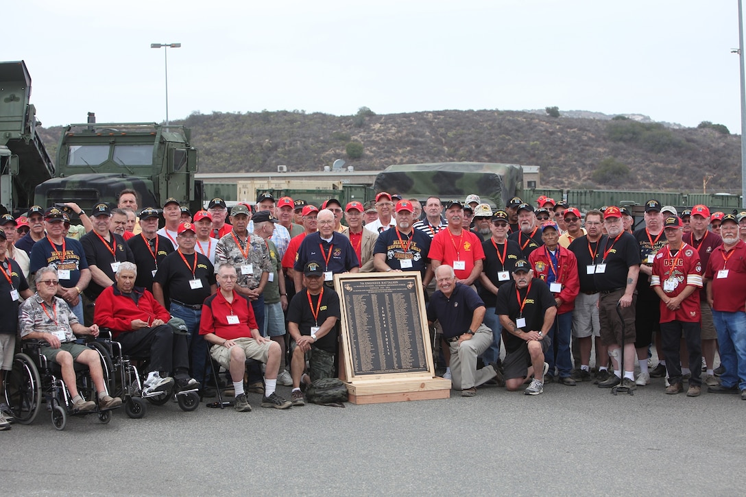 Vietnam veteran's pose for a group photo during a 7th Engineer Support Battalion reunion ceremony aboard Camp Pendleton, Calif., Sept. 20, 2013. The reunion included a full tour of the new barracks, a display of current issued gear, equipment demonstrations by Bridge Company and a luncheon in honor of the almost 200 Vietnam veterans who participated. 