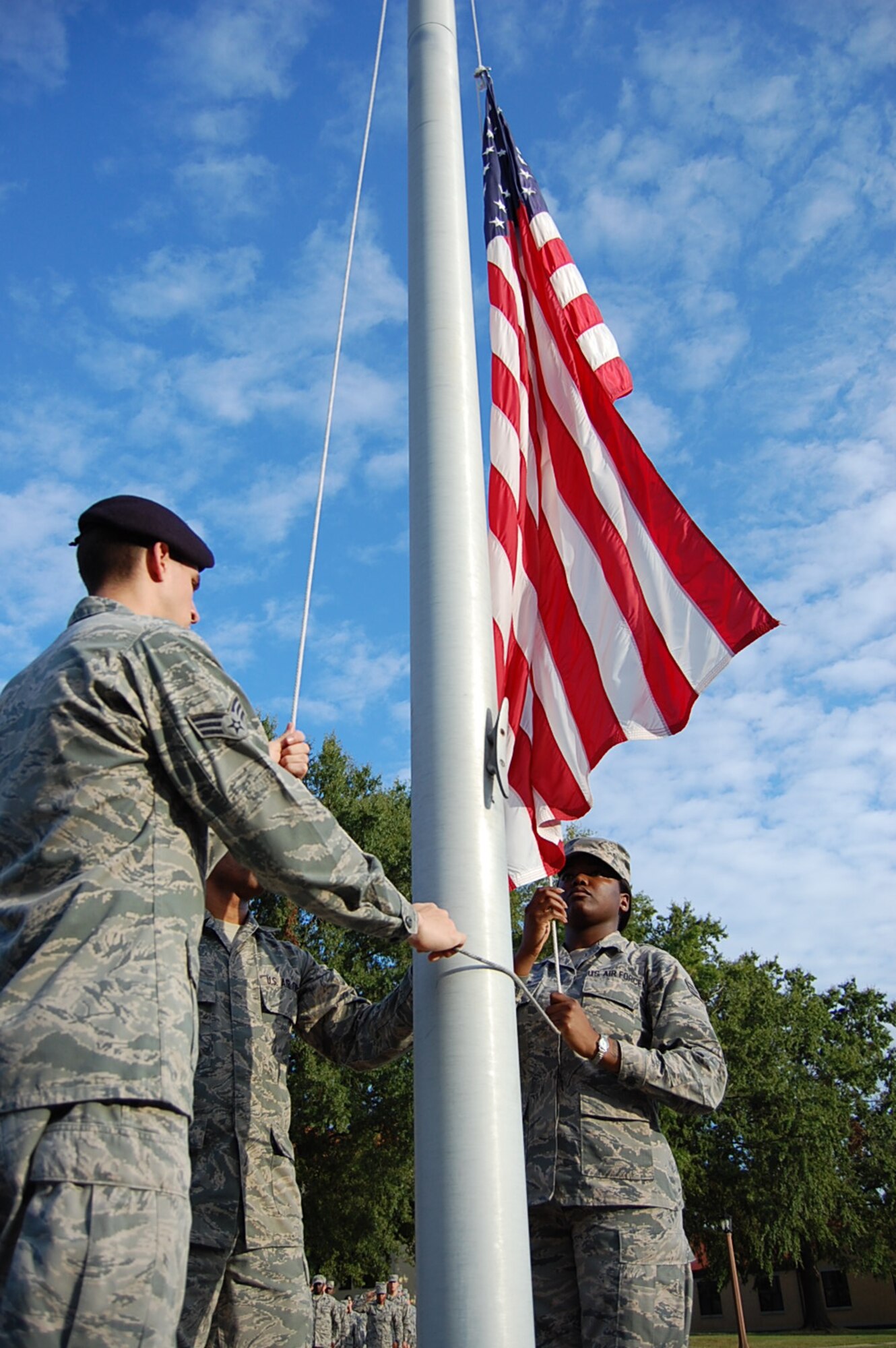 Maxwell Air Force Base Airman Leadership School class 13-7 lowers the flag while conducting retreat, Oct. 3. Despite budgetary constraints, ALS is continuing here throughout the government shutdown. (Courtesy photo)