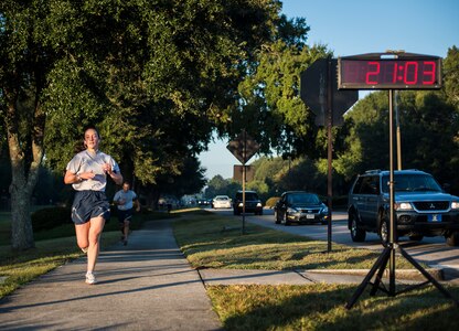 Capt. Marie Harnly, 628th Civil Engineer Squadron Chief of Operations Engineering, pushes towards the finish line during the Commander’s Challenge Run Oct. 4, 2013, at Joint Base Charleston – Air Base, S.C. The Commander's Challenge is held monthly to test Team Charleston's fitness abilities. Harnly was the top female runner with a time of 21:04. (U.S. Air Force photo/ Senior Airman Dennis Sloan)