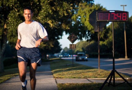 Capt. Sylvester D’Agrella, 628th Civil Engineer Explosive Ordinance Disposal flight commander, runs towards the finish line during the Commander’s Challenge Run Oct. 4, 2013, at Joint Base Charleston – Air Base, S.C. The Commander's Challenge is held monthly to test Team Charleston's fitness abilities. D’Agrella was the top male runner with a time of 17:48. (U.S. Air Force photo/ Senior Airman Dennis Sloan)