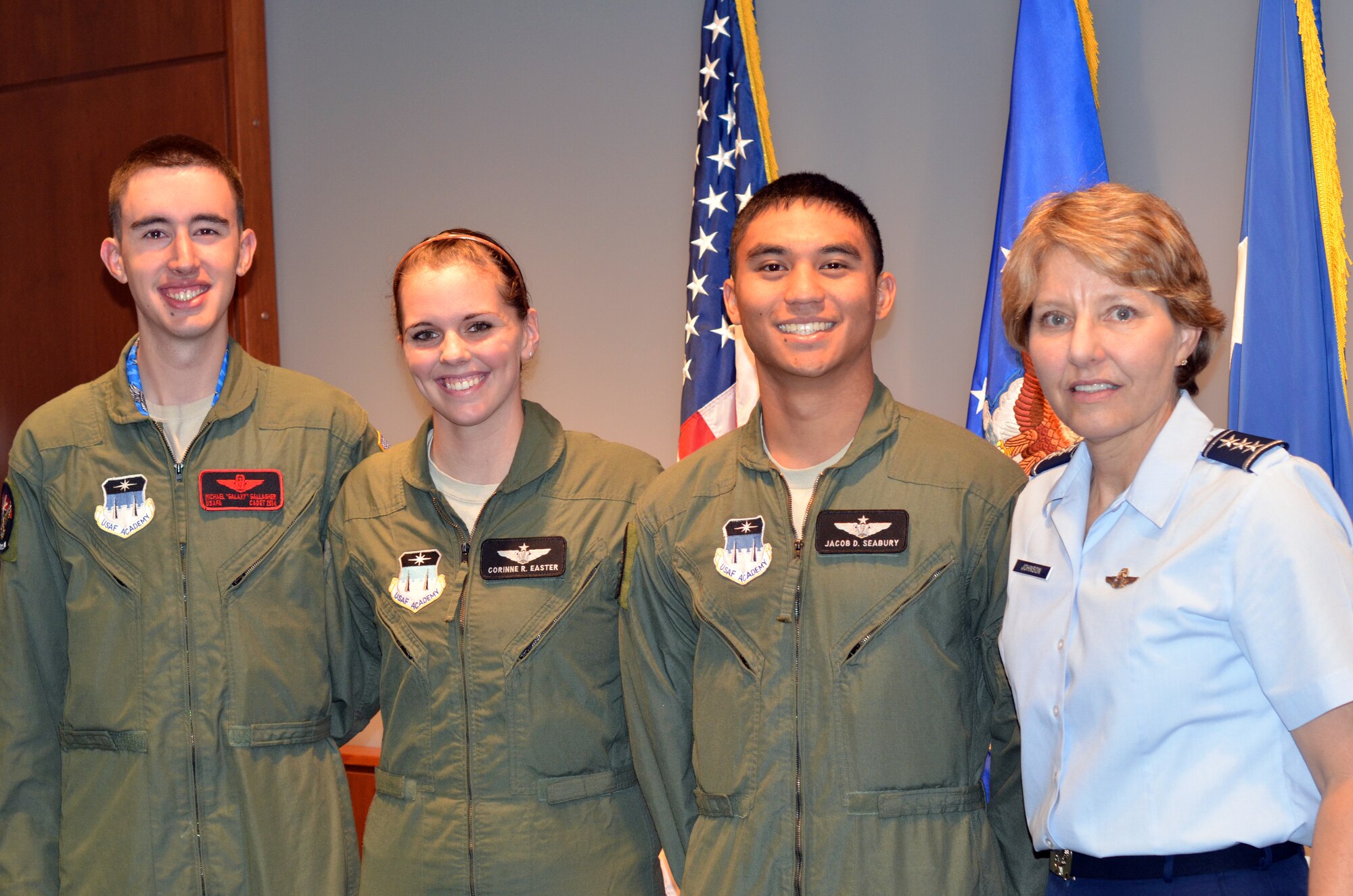 (Left to right): Cadet 1st Class Michael Gallagher, Cadet 2nd Class Cori Easter, Cadet 2nd Class Jacob Seabury, and Lt. Gen. Michelle Johnson. Easter and Seabury were recognized as the first cadet instructors of the Academy's unmanned aerial systems program after completing qualification training at Hurlburt Field, Fla. (U.S. Air Force Photo/Tech. Sgt. Vann Miller)