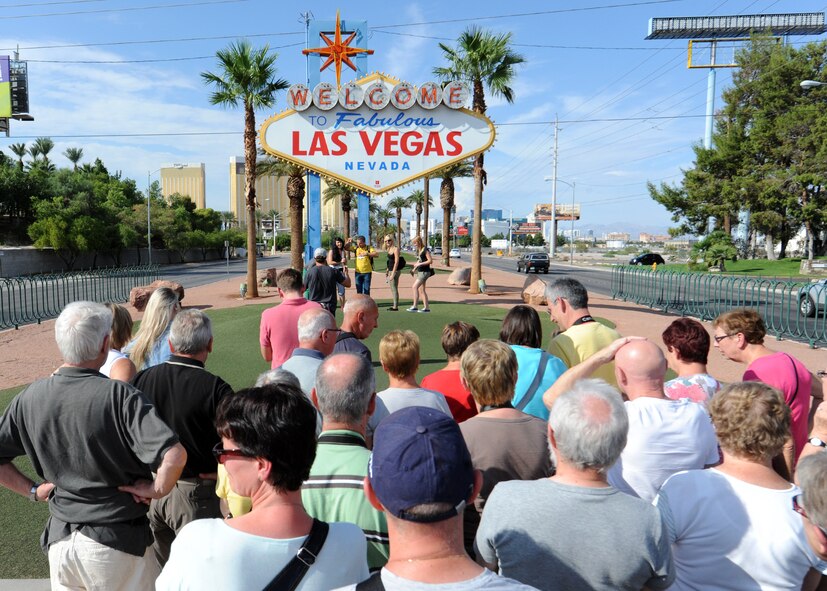 Tourists take turns posing with the famous “Welcome to Fabulous Las Vegas” sign, which marks the beginning of the Strip in Las Vegas, Nev. Most of the Las Vegas Strip centers on Las Vegas Boulevard, starting on one end with the Mandalay Bay Hotel and Casino, and ending with the Stratosphere tower. (U.S. Air Force photo/Staff Sgt. Nestor Cruz)
