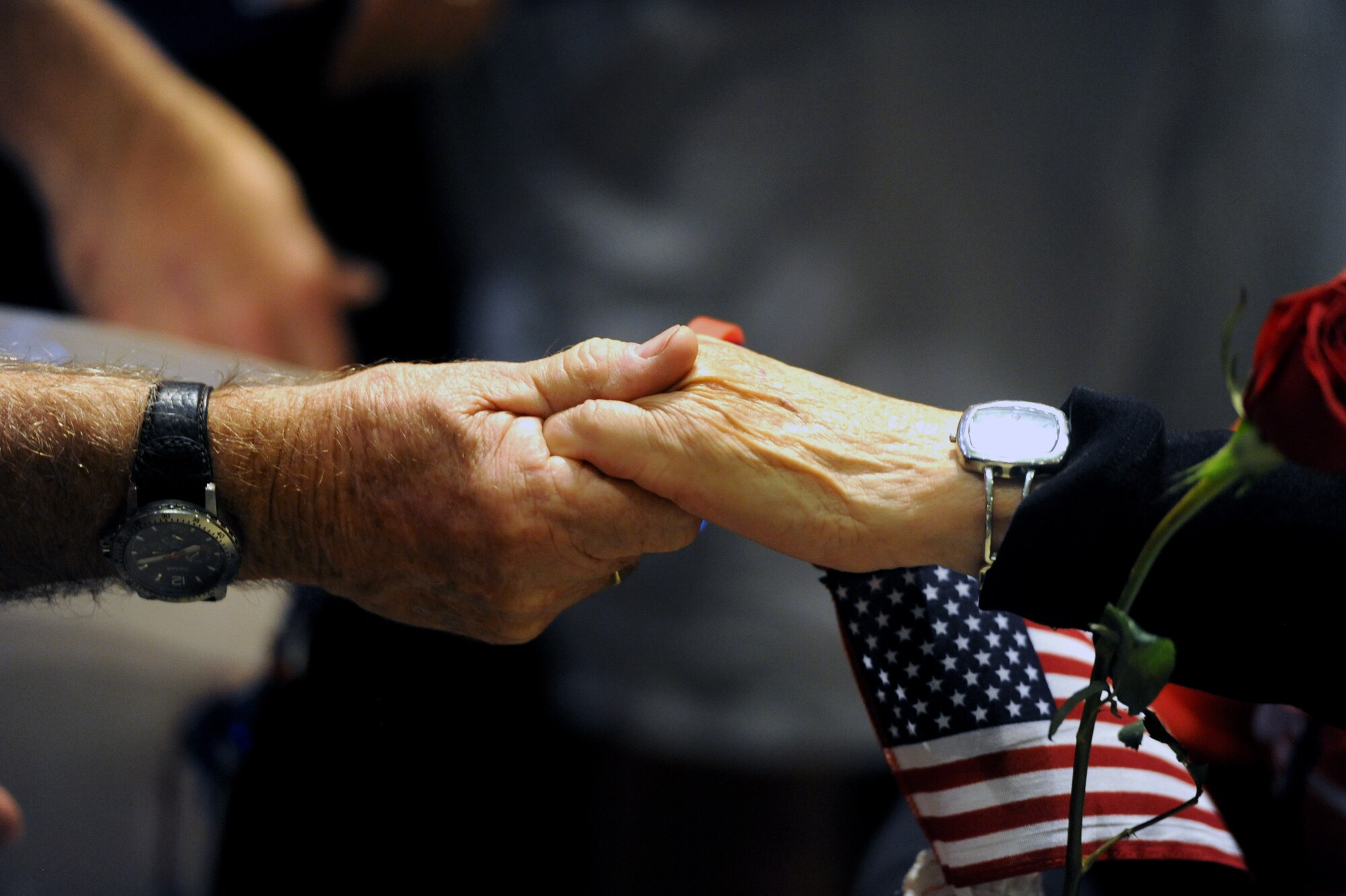 A World War II veteran shakes the hand of a supporter at the Gulfport/Biloxi International Airport after returning from the Mississippi Gulf Coast Honor Flight to Washington, D.C., Oct 1, 2013. The Honor Flight is a nonprofit program that sends veterans to see national monuments in Washington, D.C., to honor them for their service. (U.S. Air Force photos by Airman 1st Class Stephan Coleman)